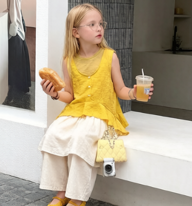 Three-piece set: sleeveless buttoned vest + skirt-pants (culottes)